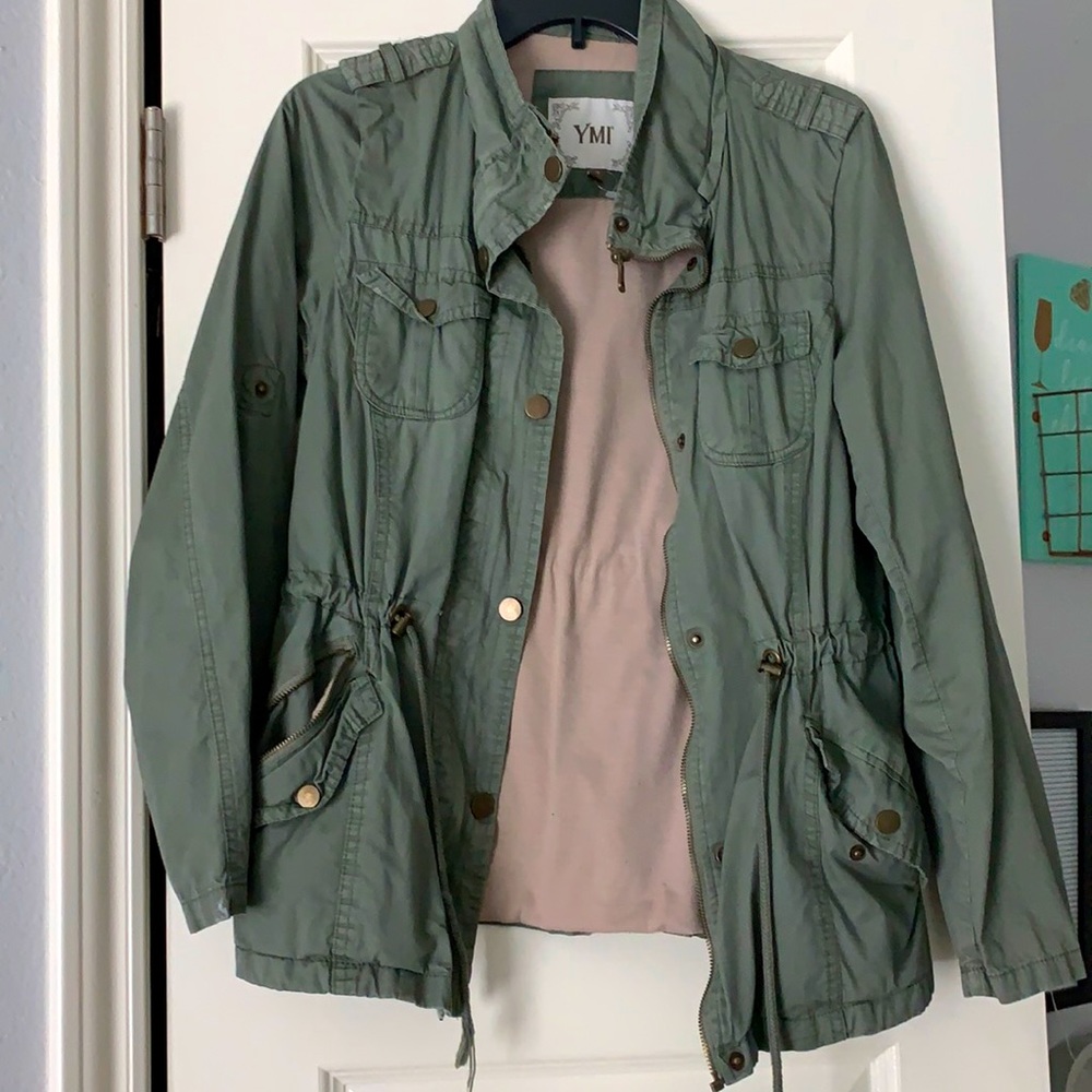 A large dark green YMR jacket